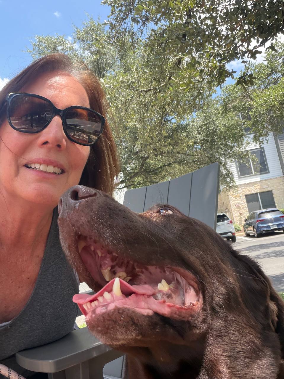 Nala smiling beside Carol outside
