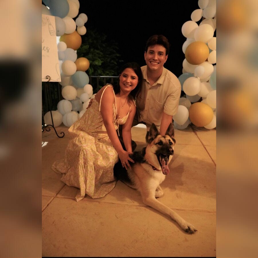 Alyssa and Daniel posing with their dog Sasha